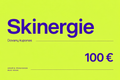 Skinergie dovanų kuponas 100 €: neon geltonas fonas, violetinės raidės